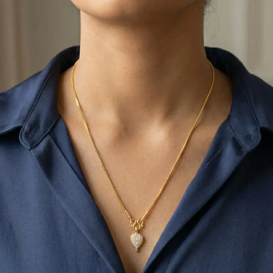 Gold Plated CZ Stone Studded Teardrop Pendant worn on a delicate gold chain.