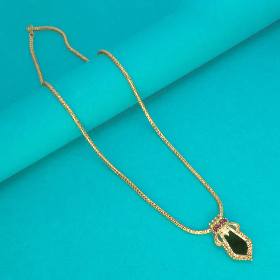 Trendy Gold Plated Small Nagapadam Pendant Necklace showcasing green enamel and synthetic ruby stones.