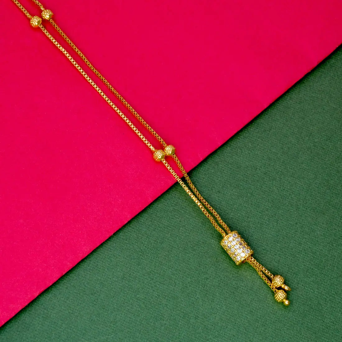 Elegant Gold Plated Cylindrical Stone Pendant Chain showcasing a stunning gem on a gold-plated box chain.