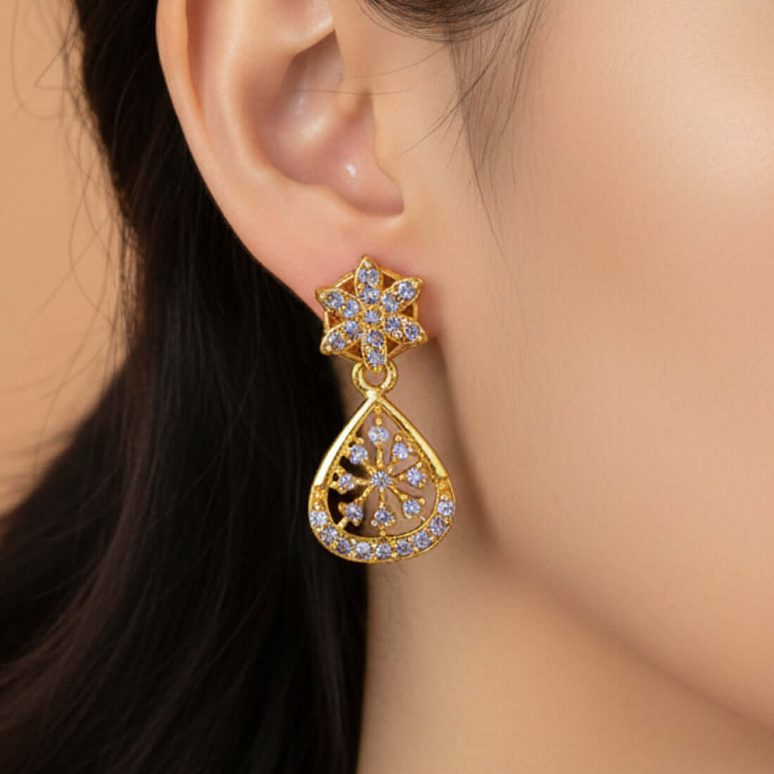 Dazzling Gold Plated Floral Purple CZ Stone Drop Earrings worn by a person