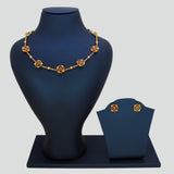 Floral Kemp Stone Antique Gold Choker Necklace Set displayed on a jewelry stand with matching earrings.