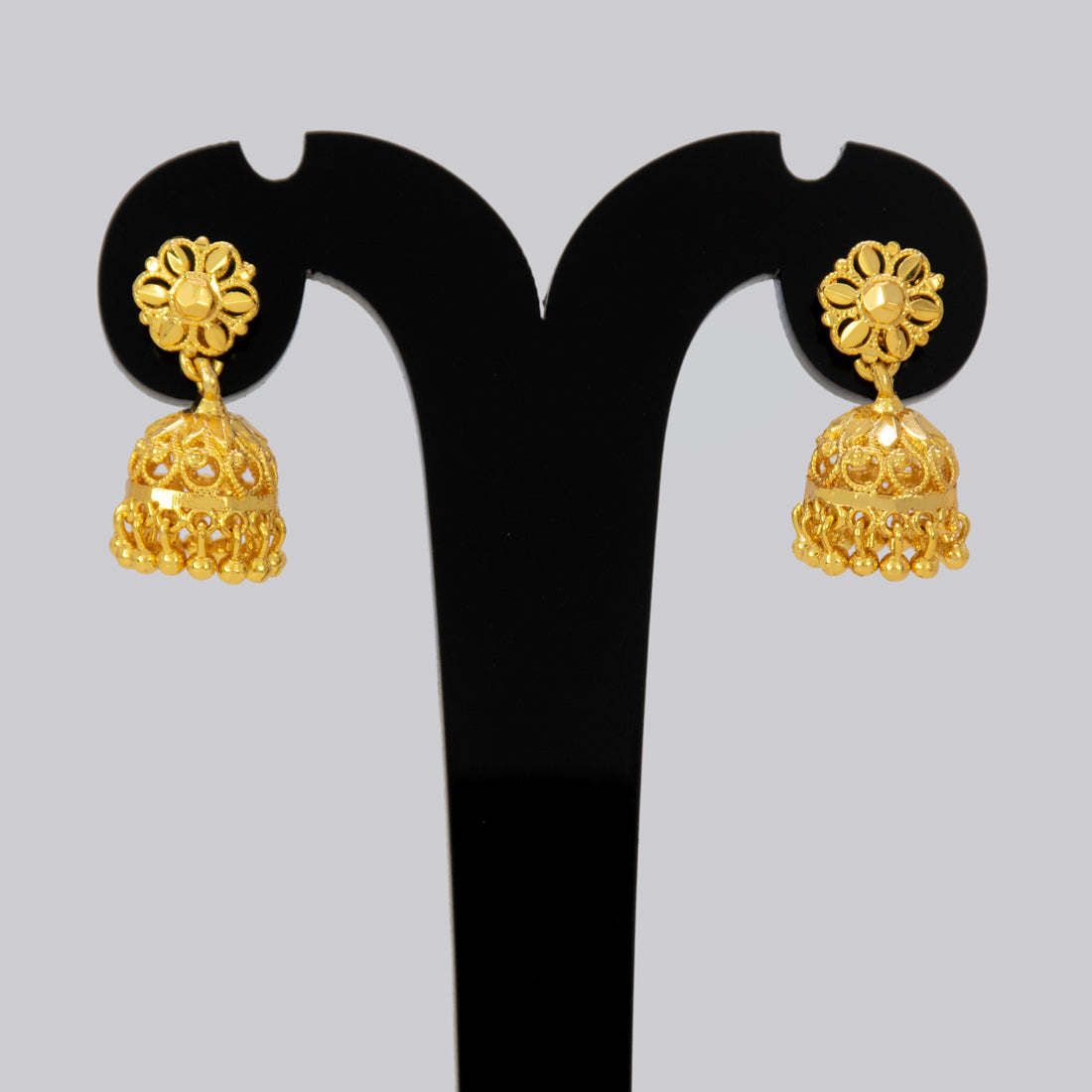 Gold-Plated Small Floral Jhumka earrings featuring intricate openwork floral design and delicate bell drop beads.