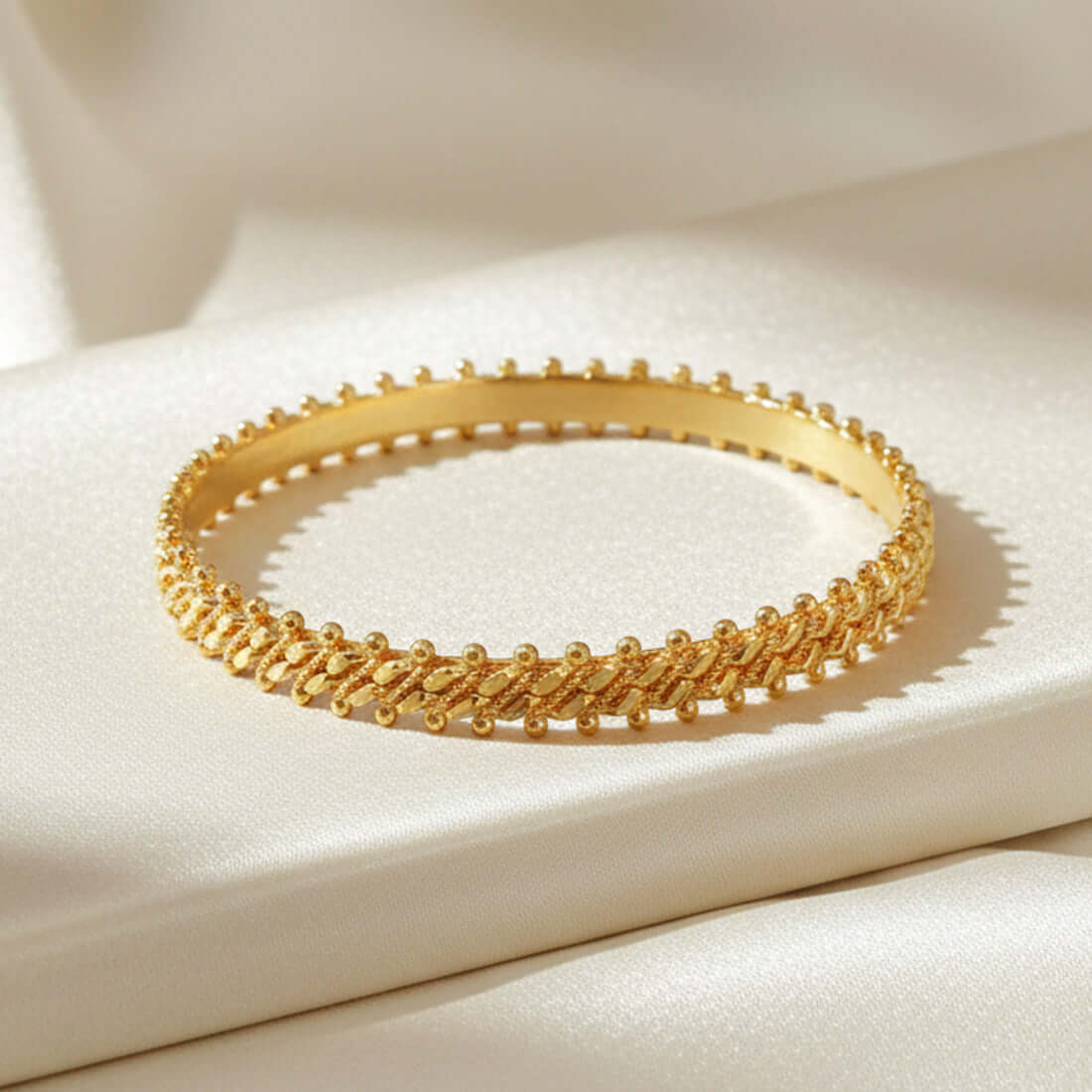 Gold Plated Two Line Designer Bangles on a luxurious fabric background, perfect for daily wear bangles.