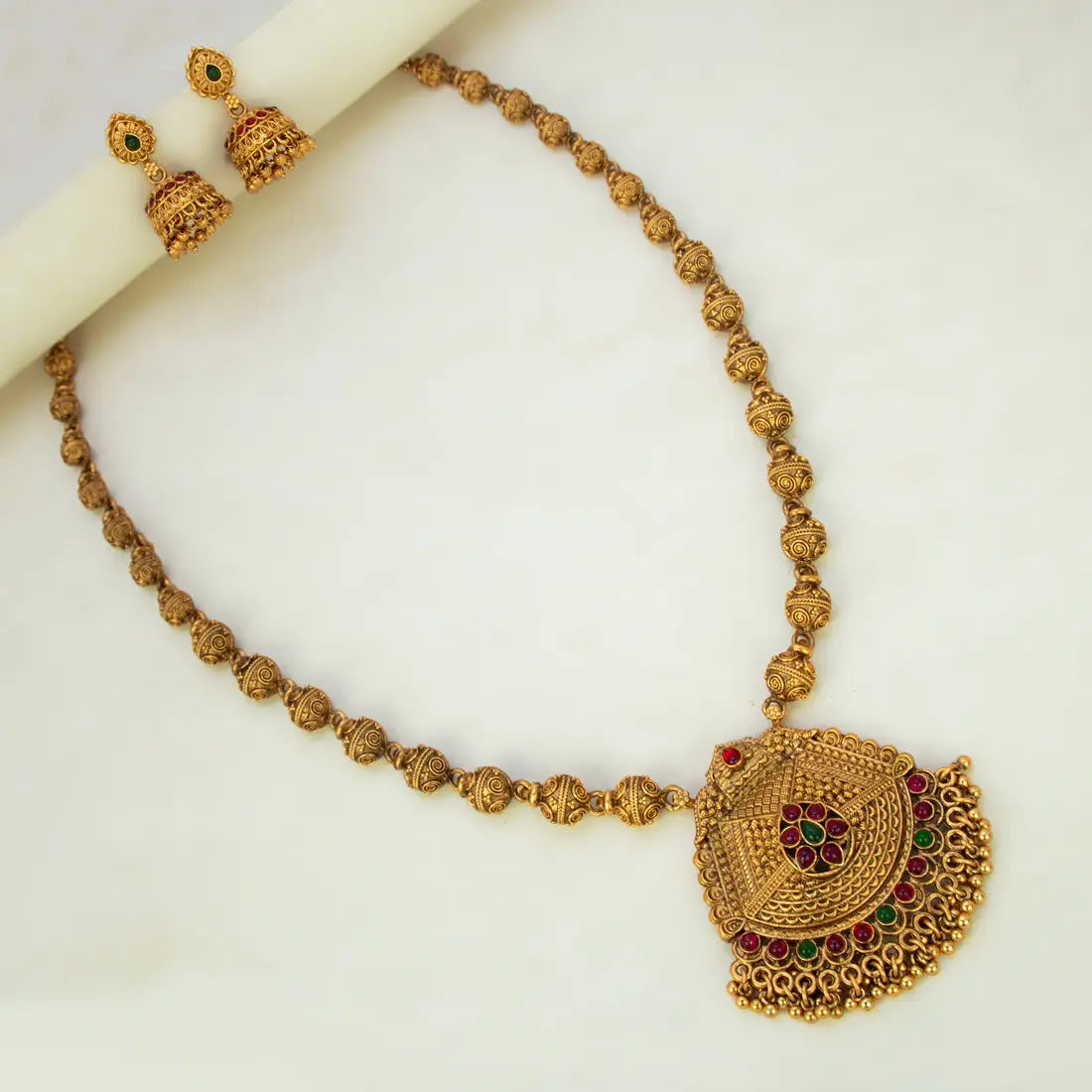 Antique Matte Gold Beads Long Chain Necklace Set with ornate kemp jhumka earrings and pendant.