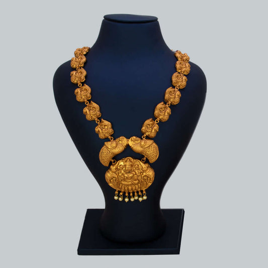 Matte Nagas Peacock Lakshmi Temple Necklace showcasing the intricate deity and peacock design on a display bust.