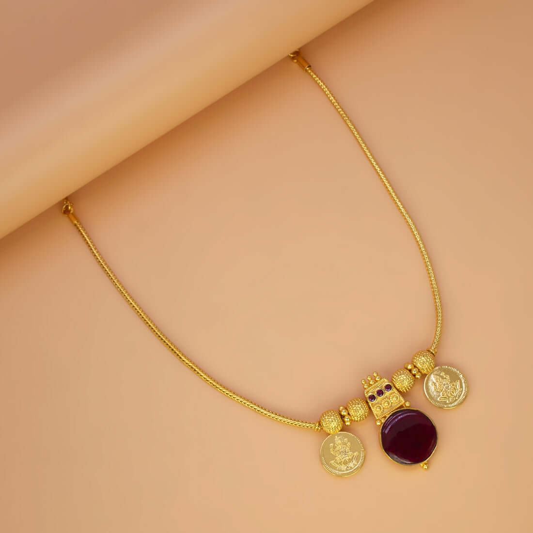 Green Enamel Gold Plated Lakshmi Kasu Necklace featuring green stone and Lakshmi coins.