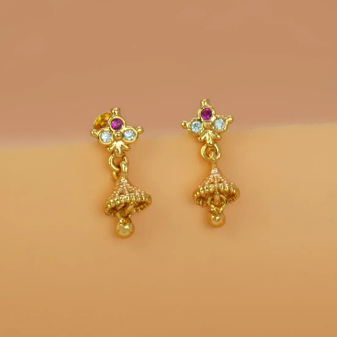 Ruby CZ Stone Small Kids Jhumka earrings featuring gold floral studs and dainty jhumka bells.