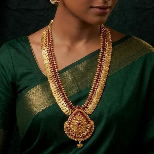 Gold-Plated Stone Lakshmi Kasu Haram Necklace worn by a model in a traditional green saree.