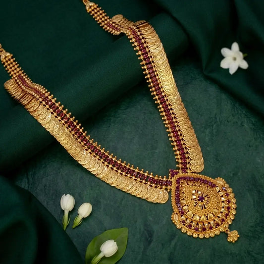 Gold-Plated Stone Lakshmi Kasu Haram Necklace featuring gold discs and a teardrop-shaped pendant.