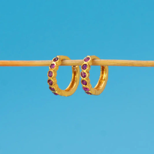 Gold Plated Stone Hoop Earrings for Women featuring purple stones set in a sleek gold finish.
