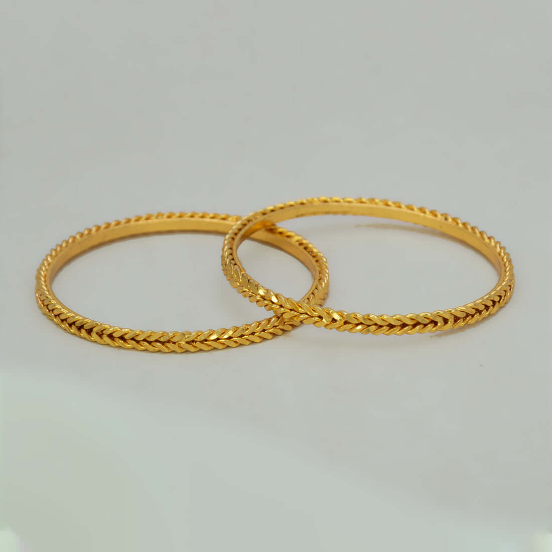 Traditional Wheat Design Gold Plated Bangles showcasing intricate woven craftsmanship and elegant spiral patterns.