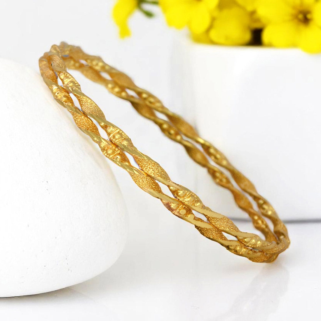 Elegant Gold Plated Designer Spiral Bangles showcasing a twisted spiral design, perfect for daily wear and versatile styling.