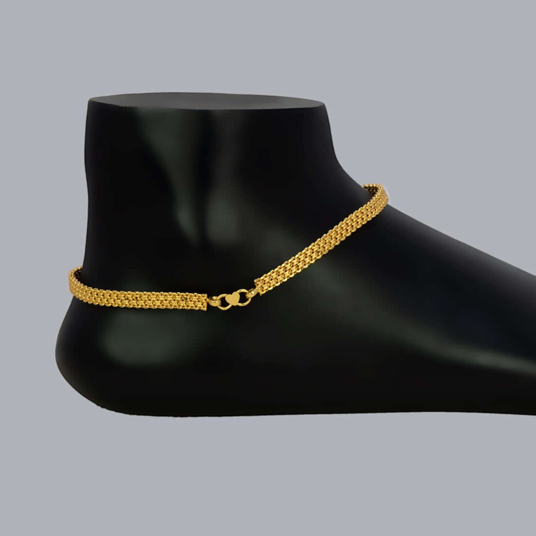Premium Gold Plated Thick Urvasi Anklets shown on a display foot, showcasing a secure clasp and elegant flat design.