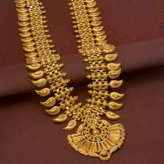 Traditional South Indian Bridal Mango Long Chain Haram showcasing intricate gold-plated design on a maroon background.